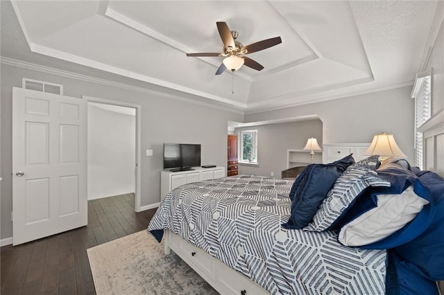 9805 W 121st Ter, Overland Park, KS 66213 - bedroom featuring a tray ceiling, dark wood-style floors, ceiling fan, and ornamental molding