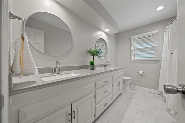 9805 W 121st Ter, Overland Park, KS 66213 - bathroom with double vanity, marble finish flooring, and recessed lighting