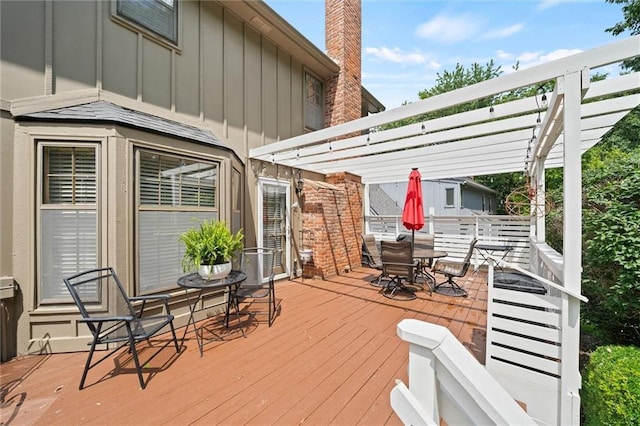 9805 W 121st Ter, Overland Park, KS 66213 - deck featuring outdoor dining space and a pergola