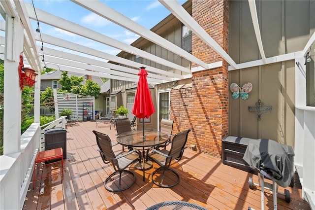 9805 W 121st Ter, Overland Park, KS 66213 - wooden terrace with a pergola and outdoor dining area