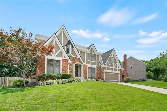 9805 W 121st Ter, Overland Park, KS 66213 - tudor house with concrete driveway, brick siding, and stucco siding