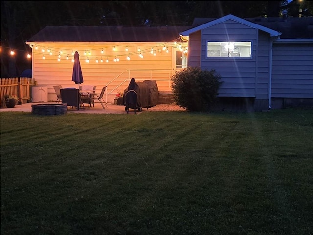1934 E Mechanic Ave, Independence, MO 64050 - view of yard featuring an outdoor fire pit and a patio