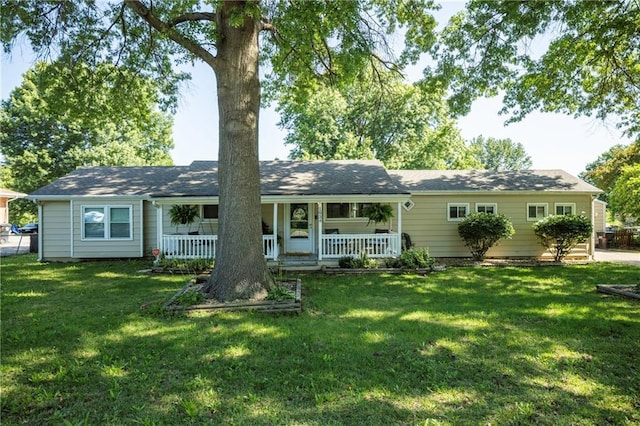 1934 E Mechanic Ave, Independence, MO 64050 - back of property with covered porch and a yard