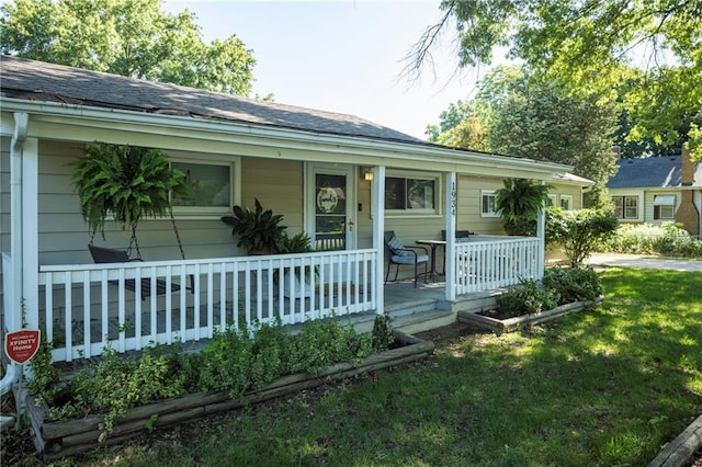 1934 E Mechanic Ave, Independence, MO 64050 - view of front of property featuring covered porch and a front lawn