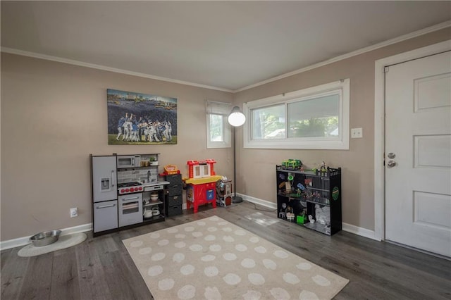 1934 E Mechanic Ave, Independence, MO 64050 - recreation room with crown molding and dark wood-type flooring