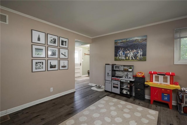1934 E Mechanic Ave, Independence, MO 64050 - playroom with dark wood-type flooring and crown molding