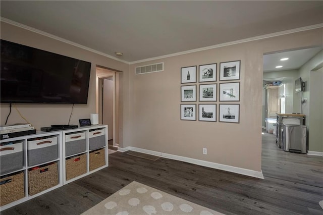 1934 E Mechanic Ave, Independence, MO 64050 - living area featuring dark wood-type flooring and ornamental molding