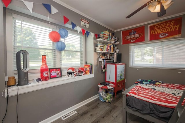 1934 E Mechanic Ave, Independence, MO 64050 - bedroom with ornamental molding, wood finished floors, multiple windows, and ceiling fan