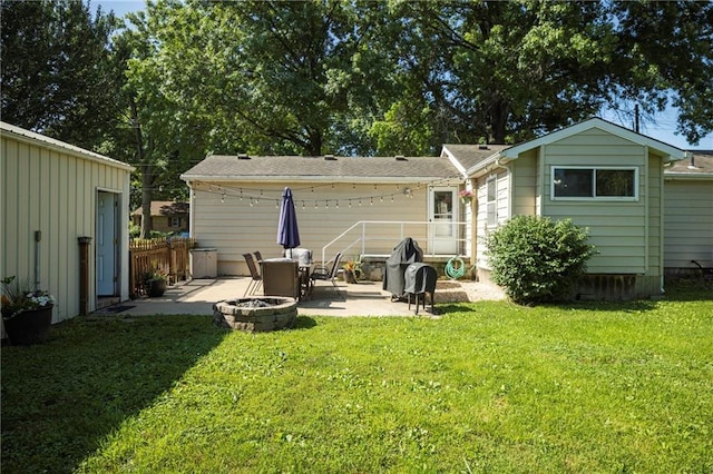 1934 E Mechanic Ave, Independence, MO 64050 - rear view of house featuring a patio area and an outdoor fire pit