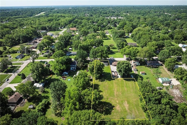 1934 E Mechanic Ave, Independence, MO 64050 - aerial view of property and surrounding area with a heavily wooded area and property boundaries highlighted