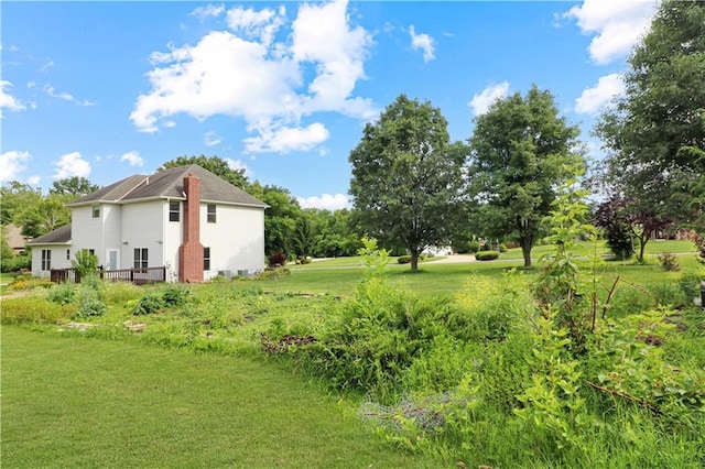 1503 Nottingham Dr, Warrensburg, MO 64093 - view of grassy yard featuring a deck