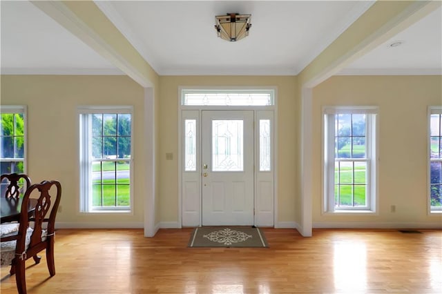 1503 Nottingham Dr, Warrensburg, MO 64093 - foyer entrance featuring light wood-style floors, plenty of natural light, and crown molding