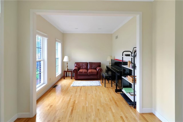 1503 Nottingham Dr, Warrensburg, MO 64093 - living room with light wood-style flooring and ornamental molding