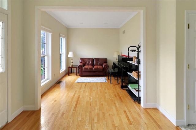1503 Nottingham Dr, Warrensburg, MO 64093 - sitting room featuring light wood-type flooring and ornamental molding