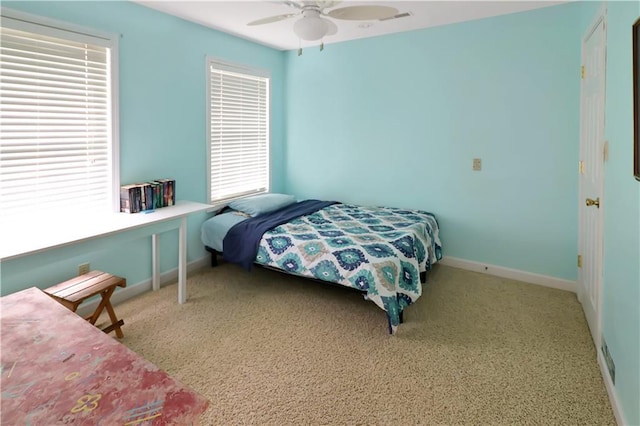 1503 Nottingham Dr, Warrensburg, MO 64093 - carpeted bedroom with baseboards and ceiling fan