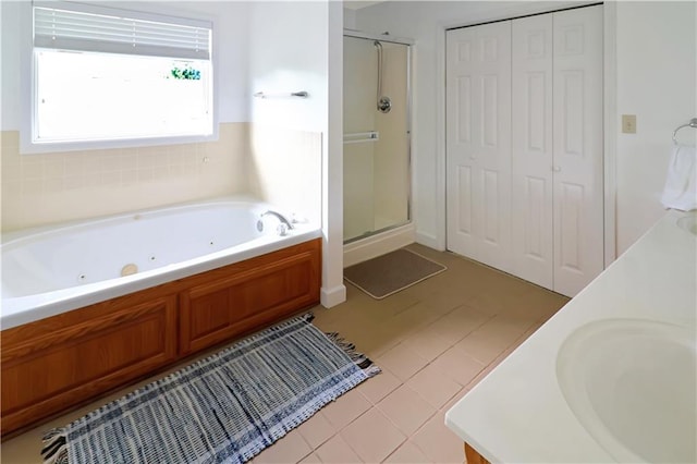 1503 Nottingham Dr, Warrensburg, MO 64093 - bathroom featuring a shower stall, a whirlpool tub, a closet, and vanity