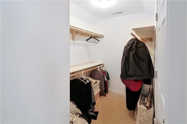 1503 Nottingham Dr, Warrensburg, MO 64093 - walk in closet with lofted ceiling and carpet floors