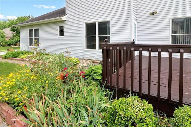 1503 Nottingham Dr, Warrensburg, MO 64093 - view of side of home with a wooden deck and a shingled roof