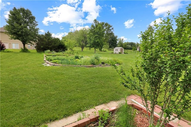 1503 Nottingham Dr, Warrensburg, MO 64093 - view of green lawn with a storage shed