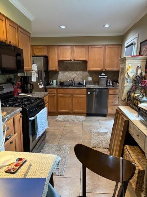 9105 W 95th Ter, Overland Park, KS 66212 - kitchen with black appliances, ornamental molding, decorative backsplash, brown cabinets, and light tile patterned floors