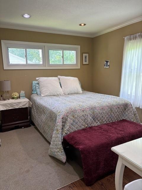 9105 W 95th Ter, Overland Park, KS 66212 - bedroom with multiple windows, ornamental molding, and recessed lighting