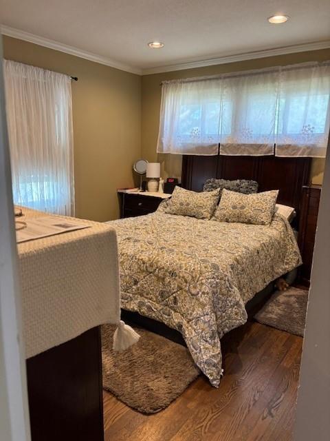 9105 W 95th Ter, Overland Park, KS 66212 - bedroom featuring wood finished floors, crown molding, and recessed lighting