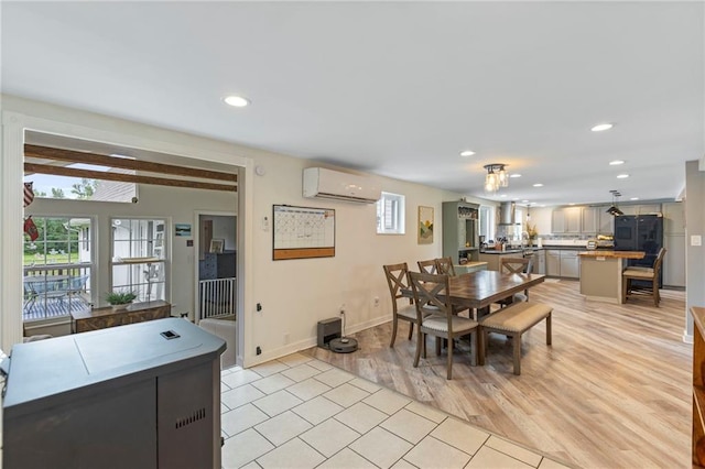 4901 E 215th St, Belton, MO 64012 - dining space with an AC wall unit, recessed lighting, and light tile patterned floors