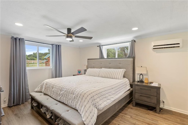 4901 E 215th St, Belton, MO 64012 - bedroom with a wall mounted AC, light wood-type flooring, recessed lighting, crown molding, and ceiling fan