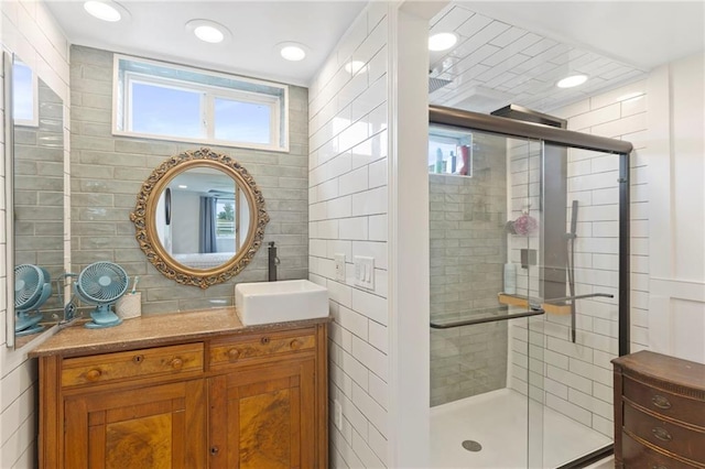 4901 E 215th St, Belton, MO 64012 - bathroom with vanity, a stall shower, recessed lighting, and tile walls