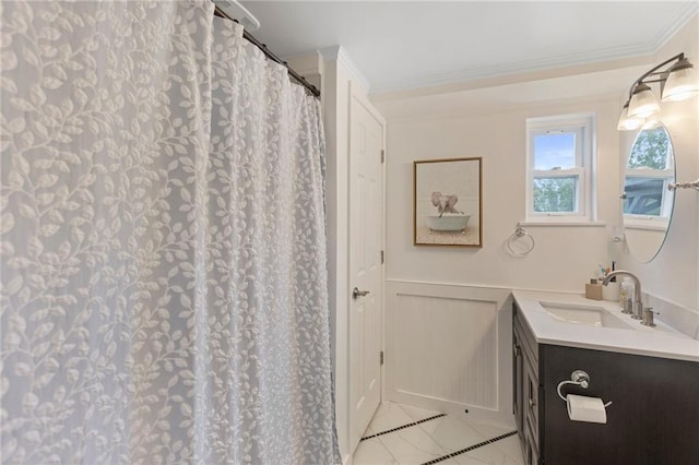 4901 E 215th St, Belton, MO 64012 - full bath featuring vanity, a wainscoted wall, crown molding, a decorative wall, and tile patterned floors