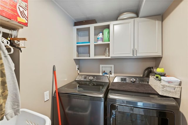 4901 E 215th St, Belton, MO 64012 - laundry room featuring washing machine and dryer and cabinet space