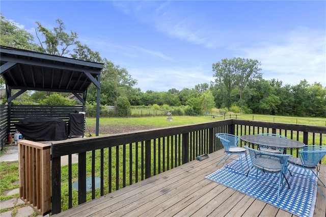 4901 E 215th St, Belton, MO 64012 - wooden deck featuring outdoor dining area and a fenced backyard
