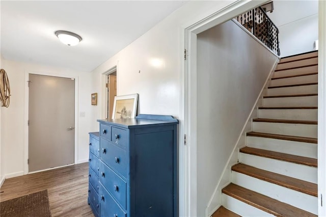 4901 E 215th St, Belton, MO 64012 - staircase featuring wood finished floors and baseboards