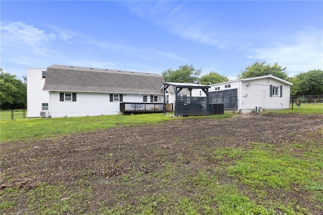 4901 E 215th St, Belton, MO 64012 - back of house with a deck and a shingled roof