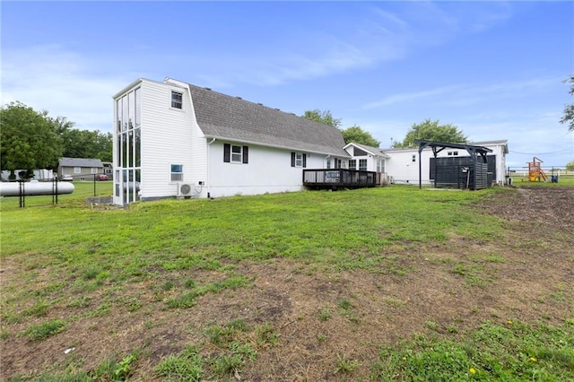 4901 E 215th St, Belton, MO 64012 - back of house with roof with shingles and a deck