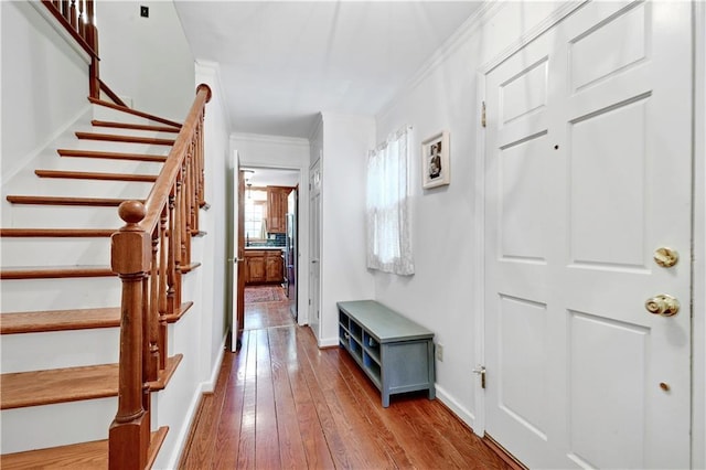 4912 W 69th St, Prairie Village, KS 66208 - foyer entrance featuring crown molding, wood-type flooring, and stairs