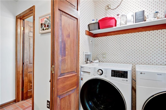 4912 W 69th St, Prairie Village, KS 66208 - laundry area featuring washing machine and clothes dryer, brick patterned flooring, and wallpapered walls