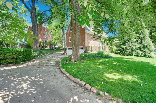 4912 W 69th St, Prairie Village, KS 66208 - view of yard featuring driveway and a garage