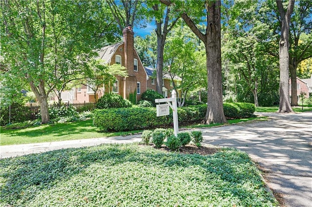 4912 W 69th St, Prairie Village, KS 66208 - view of front of property with brick siding and a chimney