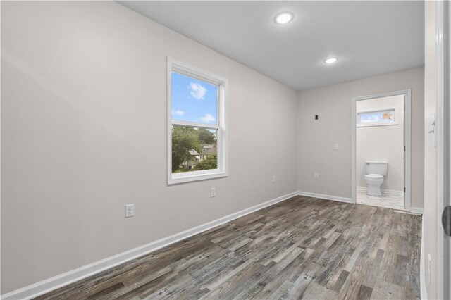3107 N 34th St, Kansas City, KS 66104 - empty room with dark wood finished floors and recessed lighting