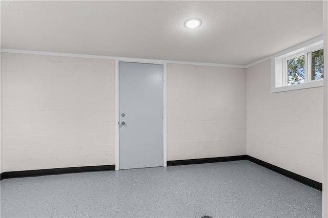 3107 N 34th St, Kansas City, KS 66104 - below grade area featuring concrete block wall and crown molding