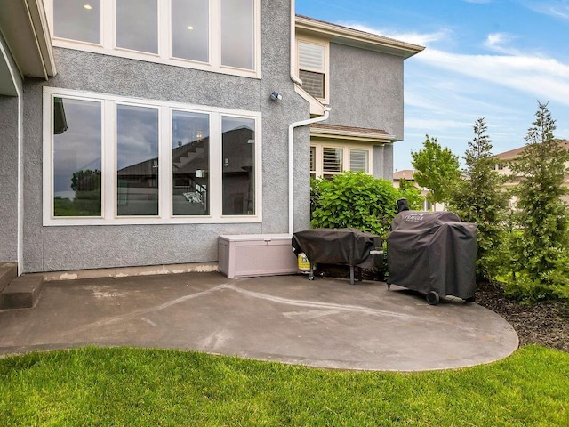 15801 Canterbury St, Overland Park, KS 66224 - back of house featuring a patio and stucco siding