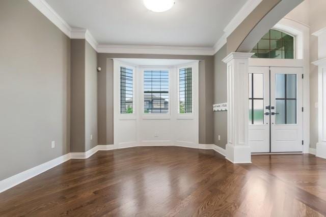15801 Canterbury St, Overland Park, KS 66224 - entrance foyer with ornate columns, ornamental molding, and wood finished floors