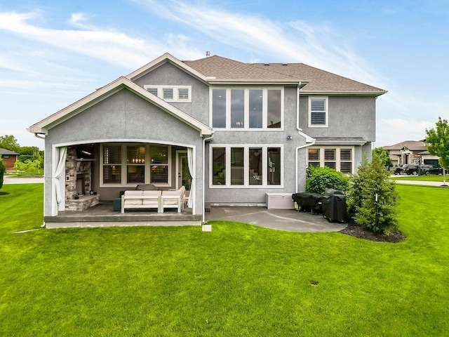 15801 Canterbury St, Overland Park, KS 66224 - back of house with a patio, stucco siding, an outdoor living space, and a yard