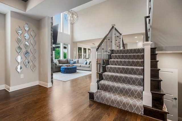 15801 Canterbury St, Overland Park, KS 66224 - stairway featuring wood finished floors and a towering ceiling