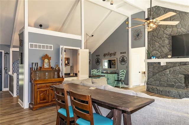 8605 Deer Run St, Lenexa, KS 66220 - dining space featuring wood finished floors, a ceiling fan, high vaulted ceiling, and beamed ceiling