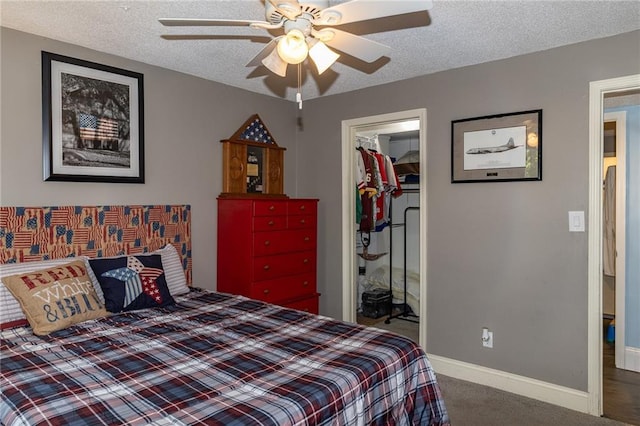 8605 Deer Run St, Lenexa, KS 66220 - carpeted bedroom with a closet, a spacious closet, a textured ceiling, and a ceiling fan