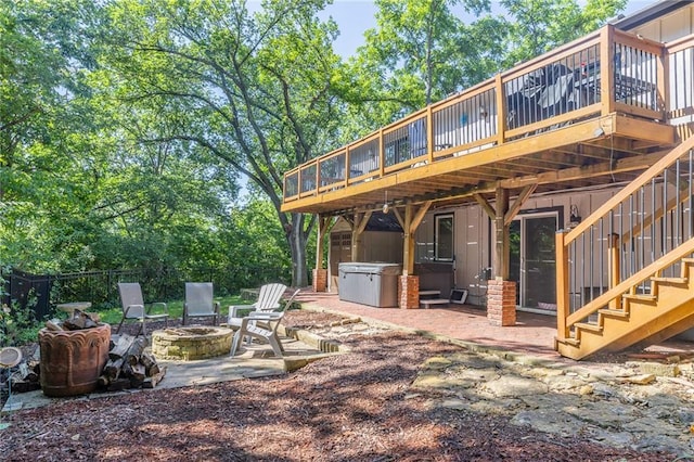 8605 Deer Run St, Lenexa, KS 66220 - back of property with an outdoor fire pit, a deck, stairs, and a patio