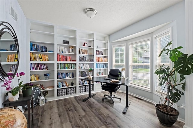 22116 W 51st St, Shawnee, KS 66226 - home office featuring a textured ceiling and wood finished floors