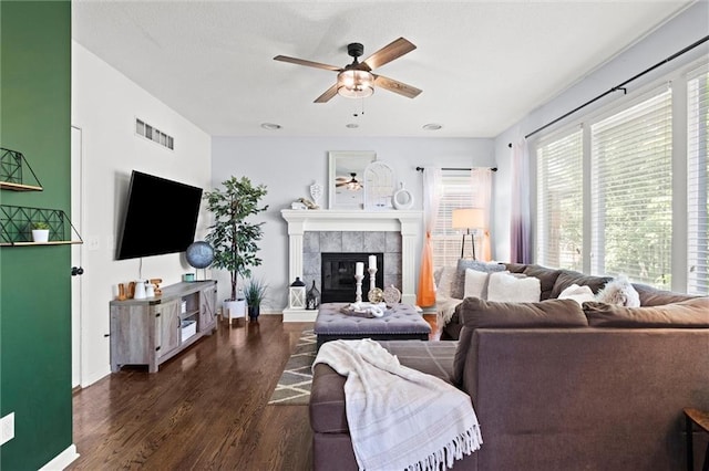 22116 W 51st St, Shawnee, KS 66226 - living area featuring ceiling fan, wood finished floors, and a tiled fireplace